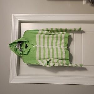 Green and white striped cardigan sweater.